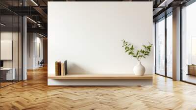 a brown wall shelf against a white wall with books and a plant Wall mural