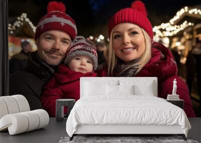 Cheerful family portrait in winter attire at a holiday market. Wall mural