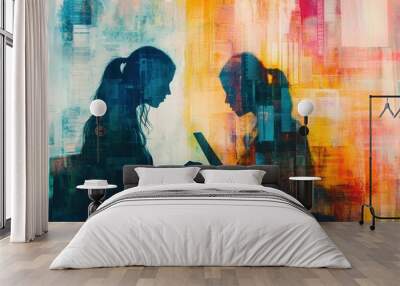 Silhouettes of two women working on a laptop against an abstract colorful background. Wall mural