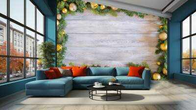 Green branch of christmas tree decorated with christmas decor on wooden table Wall mural