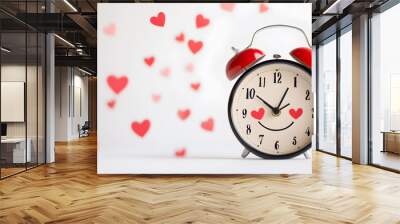 Red alarm clock with smiley face and hearts around it. Wall mural