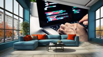 Hacker with malware code in computer screen. Cybersecurity, privacy or cyber attack. Programmer or fraud criminal writing virus software. Online firewall and privacy crime. Web data engineer. Wall mural