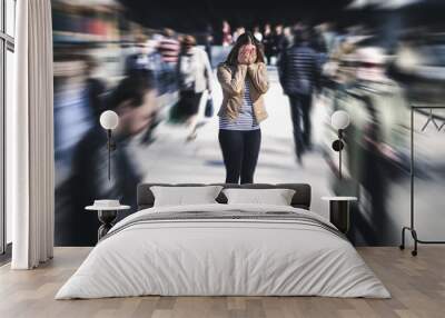 Panic attack in public place. Woman having panic disorder in city. Psychology, solitude, fear or mental health problems concept. Depressed sad person surrounded by people walking in busy street. Wall mural