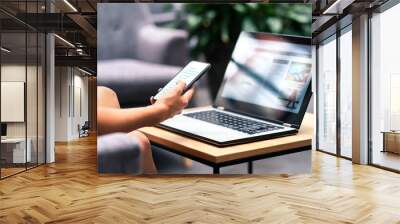 Wireless wifi for remote work in airport lounge bar, hotel lobby or cafe. Phone and laptop. Woman using smartphone and modern notebook pc computer on table. Real estate agent or student reading email. Wall mural