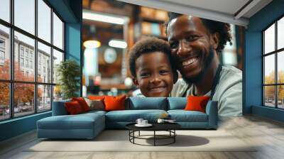 A man and a child are sitting in a barbershop Wall mural