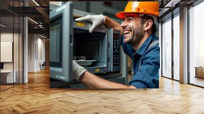 A man carefully places a vintage record player inside a microwave in a modern kitchen while smiling and enjoying the moment Wall mural