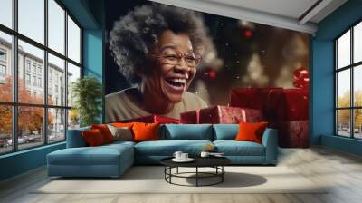 Cute mature afro american woman happy giving and receiving Christmas gifts Wall mural