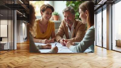 Group of friends enjoying a lively conversation around a table during golden hour in a cozy living room Wall mural