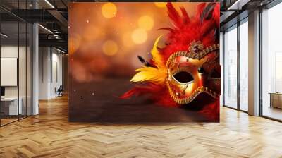 mask on the background of lights in red and gold tones ,concept carnival Wall mural