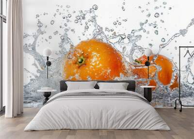 Three oranges are splashing in a pool of water Wall mural