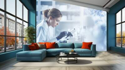 woman scientist looking through the microscope in lab. Wall mural