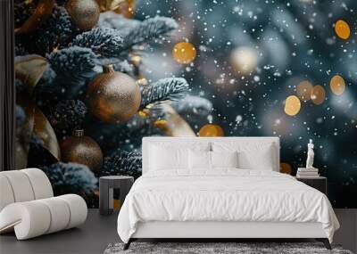 A close-up of a snow-covered Christmas tree, adorned with golden ribbons and shining baubles, capturing the holiday spirit. Wall mural