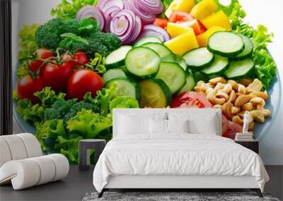 A salad plate with a variety of fresh vegetables, nuts and a light dressing on white background. Consumption of natural and nutritious foods Wall mural