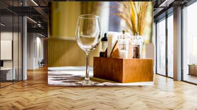 empty glass on the table on sunny day in  restaurant Wall mural