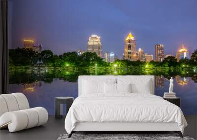 Cityscape at  Modern business area garden at dusk with twilight cloud in Bangkok, Thailand Wall mural