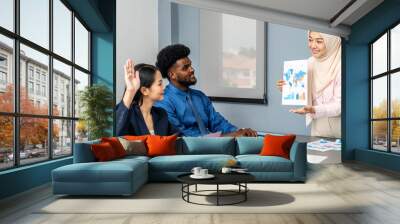 Group of multicultural business people in a discussion during a business meeting in a conference room. Happy business people, men and women, collaborating and working towards their shared goals Wall mural