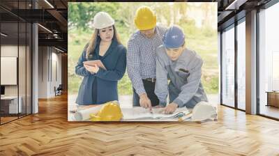 Group of Professional engineer are discussing the project building plan with his business client Wall mural