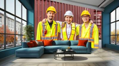 Portrait of group male and female container worker or dock foreman looking at camera and smiling together standing at warehouse logistic in Cargo freight ship for import export, friendship concept Wall mural