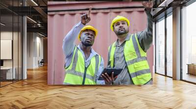 Two professional dock worker or engineering people discussing inventory lists with their supervisor while record data online with digital connection tablet at Container cargo, Import and Export Wall mural