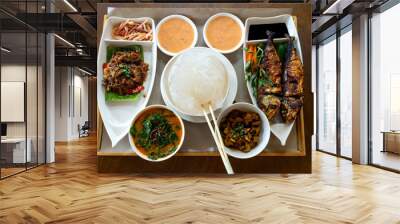 Ambuyat, national dish, local specialty traditional food from Brunei Darussalam. Toop view of Ambuyat set with starch derived from the trunk of a sago palm, on wooden table background. Wall mural