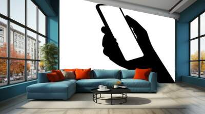 A silhouette of a smartphone in person hand. Using new computer technologies and applications for mobil phones. Wall mural