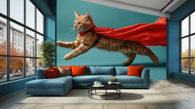 A tabby cat wearing a red cape flies through the air, its paws outstretched Wall mural