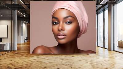 Beautiful young afro american woman with pink headband and clean fresh skin, on beige, pink background with copy space, facial skin care. Cosmetology, beauty, spa. female cosmetics concept. Wall mural