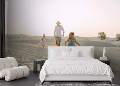 Father with two daughters in the desert in Dubai Wall mural