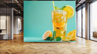 Glass of Long Island iced tea with citrus fruits and bag on colorful background Wall mural