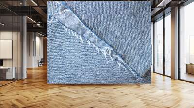 Light blue denim texture or denim background with thread, textile material Wall mural