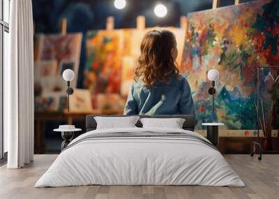 Little beautiful child draws on an easel in an art studio drawing school creativity generative AI Wall mural