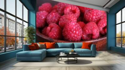 Fresh raspberries on a wooden background. Wall mural