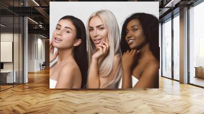 Different nation woman: African-american, Caucasian together isolated on white background happy smiling, diverse type on skin.  Different ethnicity women - on white background. Wall mural