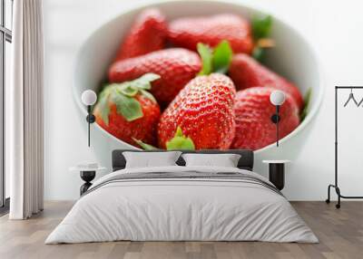 Fresh, bright juicy strawberries in white bowl isolated on white background, close-up Wall mural