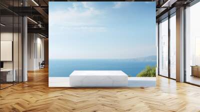 White marble square podium with sea view on a sunny summer day in the background. High quality photo Wall mural