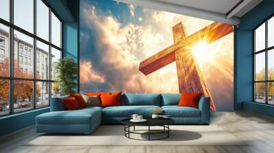 Wooden cross standing tall against a cloudy sky Wall mural