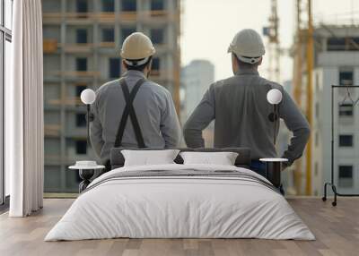 Two construction workers standing, cinematic shot Wall mural