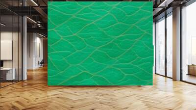 An abstract pattern of green waves resembling water surface, with a textured appearance a vibrant green color with a marbled effect, resembling jade. The light creates movement in the design. Wall mural