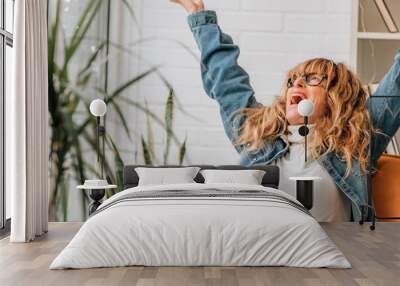 happy relaxed woman on the sofa at home Wall mural