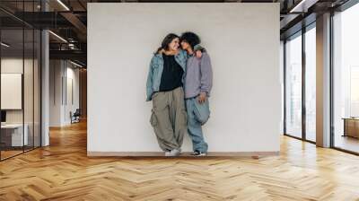 happy teen couple hugging on wall Wall mural