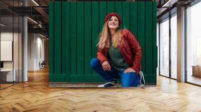 urban woman posing on green street wall Wall mural