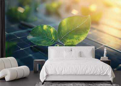 Close-up of fresh green leaves growing on a solar panel, symbolizing sustainability and the fusion of nature with technology. Wall mural