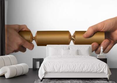 male and female hands pulling a gold christmas cracker Wall mural