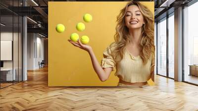 Woman Balancing on One Hand While Juggling Tennis Balls Wall mural