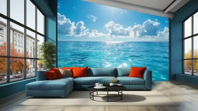 A sparkling blue sea under a clear sky Wall mural