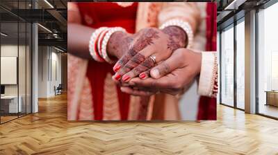 Indian, bride and hands with ring, marriage and morning with henna, luxury and culture for woman. Celebration, jewellery and person with clothes in wedding, ceremony or traditional for event in Dubai Wall mural