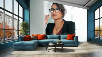 Computer, research and business woman in glasses reflection for reading, online review or editor analysis. Focused Latino person or professional worker in website editing or analytics on desktop pc Wall mural