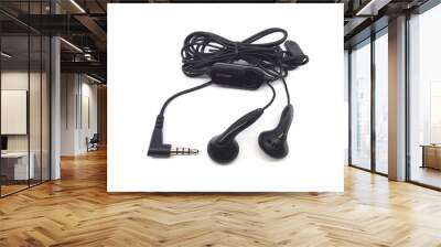 Earphones for mobile phone isolated on white background. Black earbud for smartphone. Wall mural