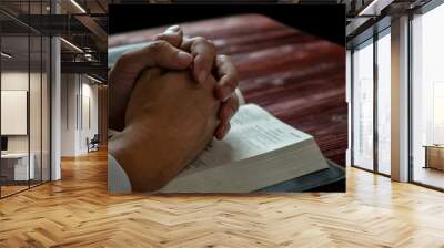 Man Praying to God with His Bible, Prayer with Reading the Bible on the Wood Table Wall mural