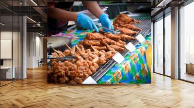 Fried chicken for sale at street food market Wall mural